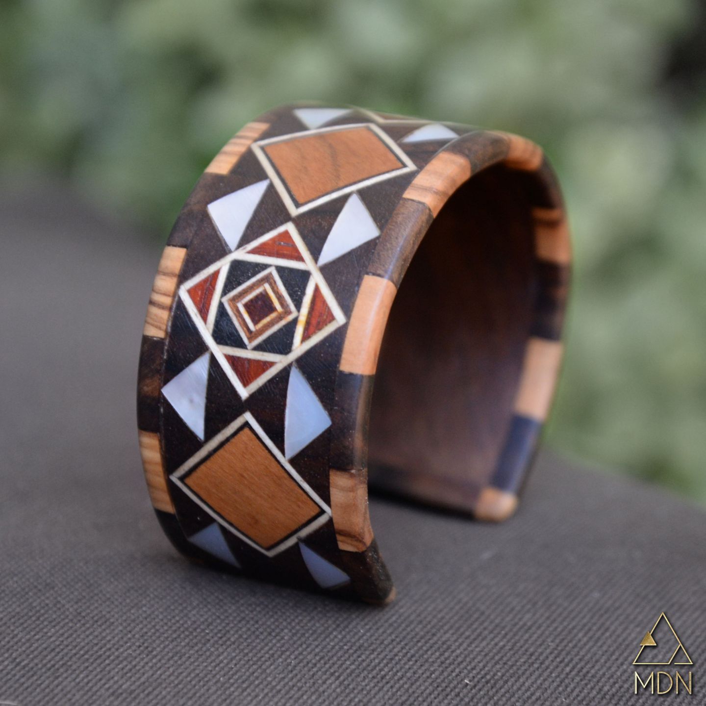 Cuff with geometric mosaic inlay in brown and white