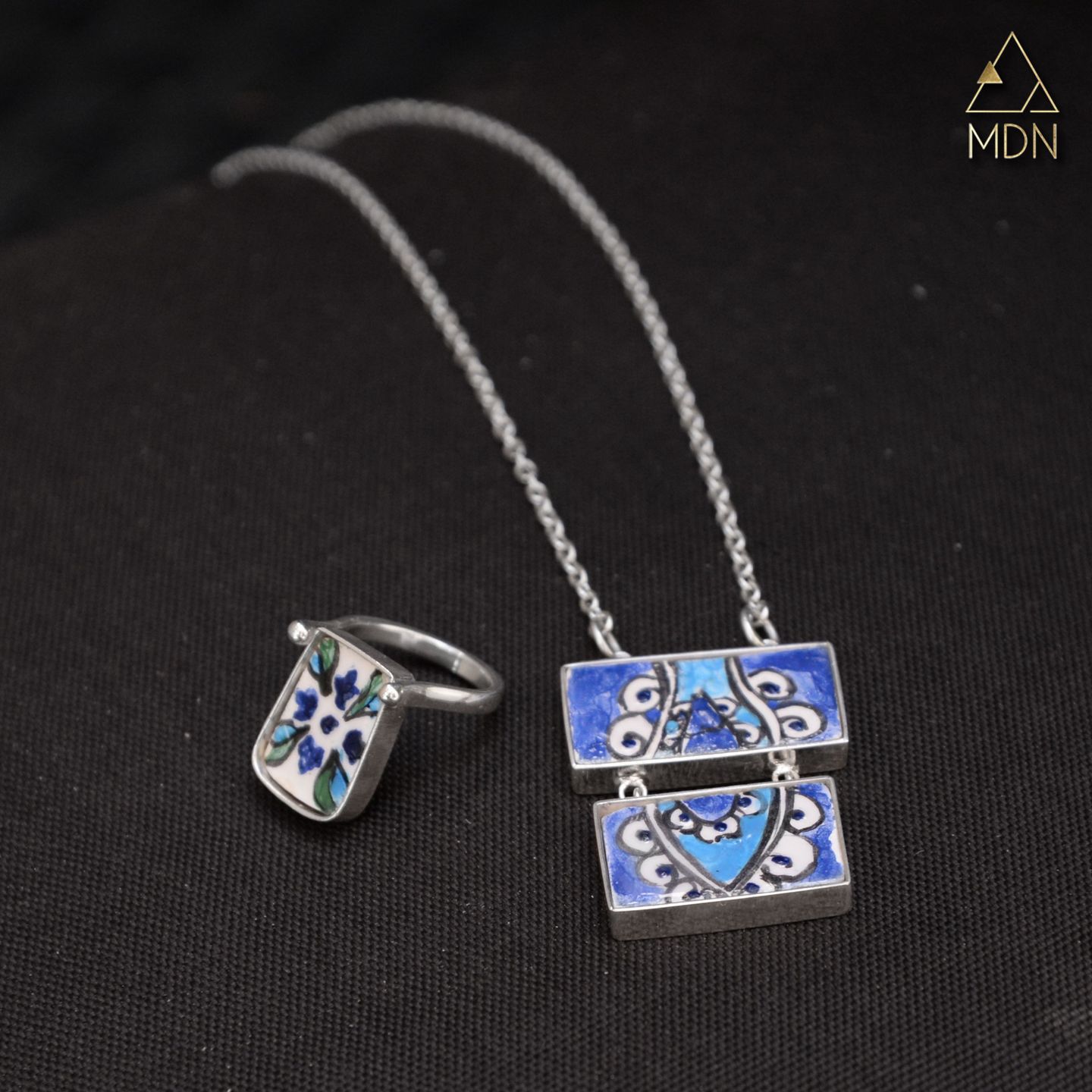 Mosaic inlay ring and square pendant necklace.