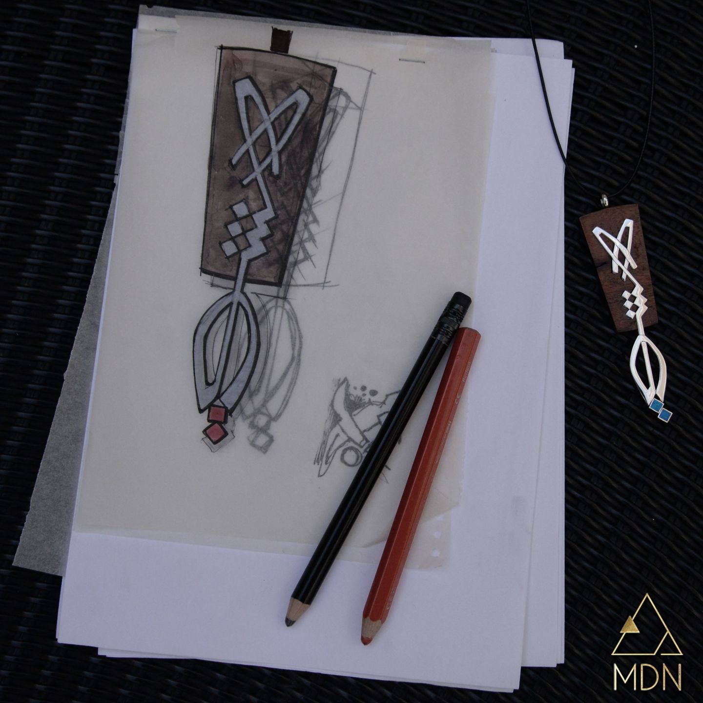 Pair of earrings with pointed geometric pendant shape in white stone.