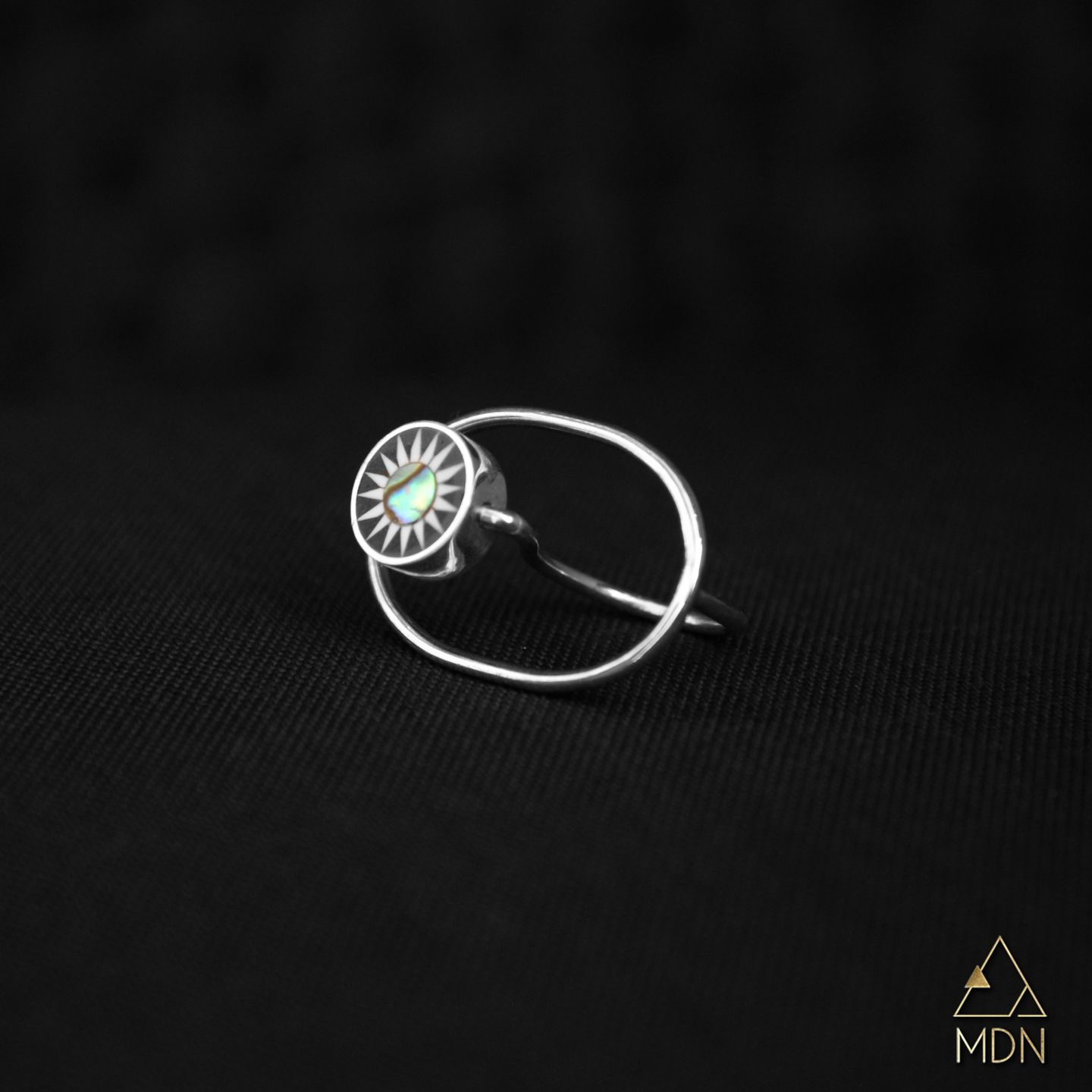 Ring with silver-toned geometric circular design