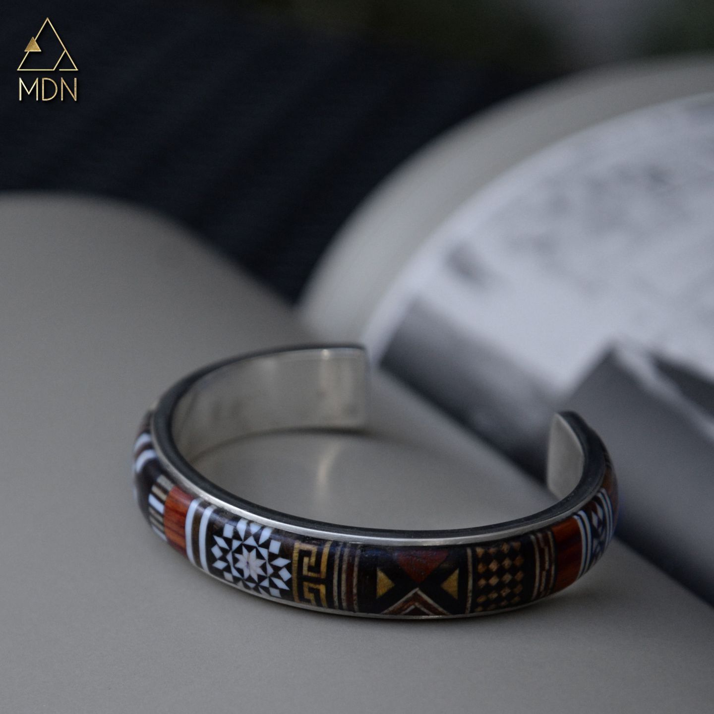Bracelet with mosaic inlay geometric pattern in dark tones