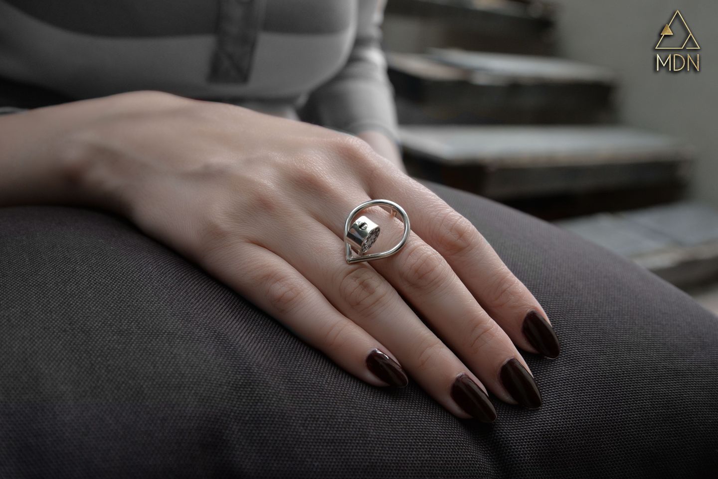 Ring with silver-toned geometric circular pattern