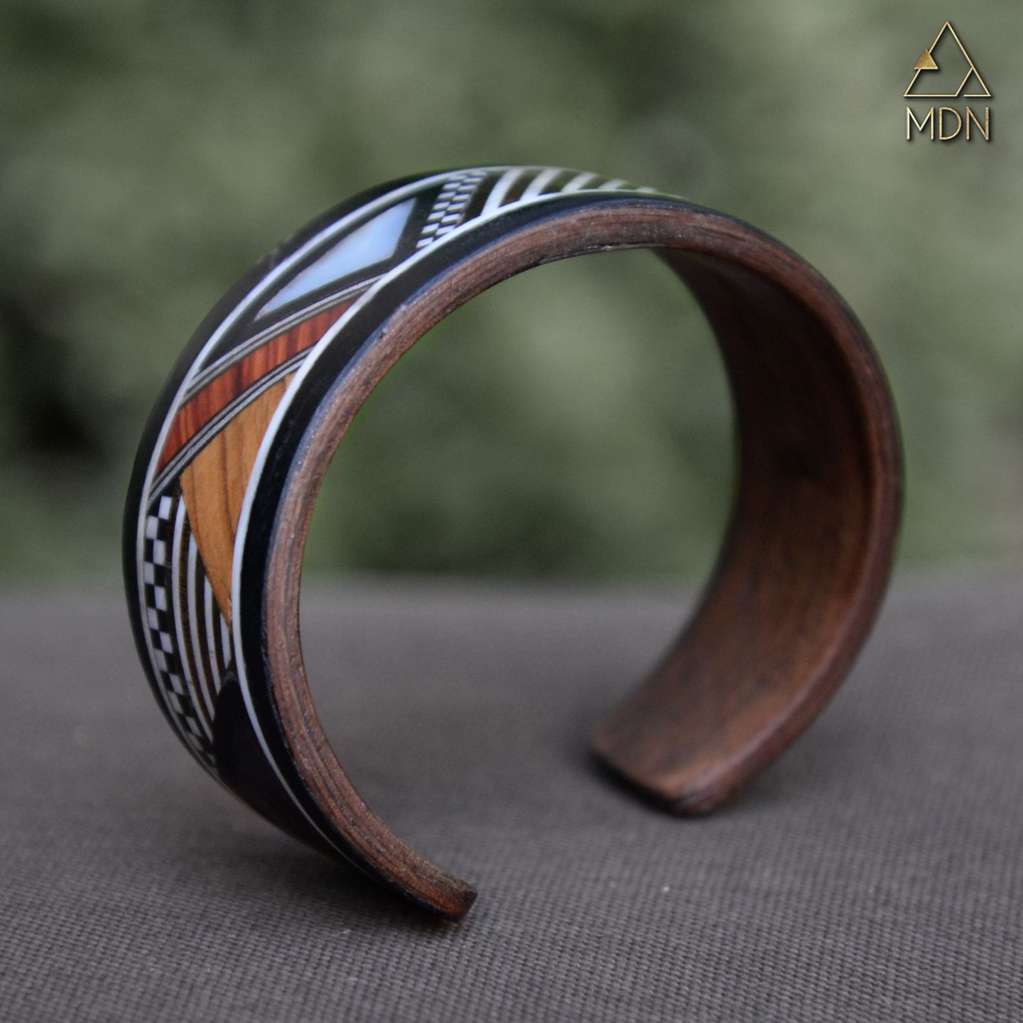 Cuff with mosaic inlay in blue and copper geometric tones