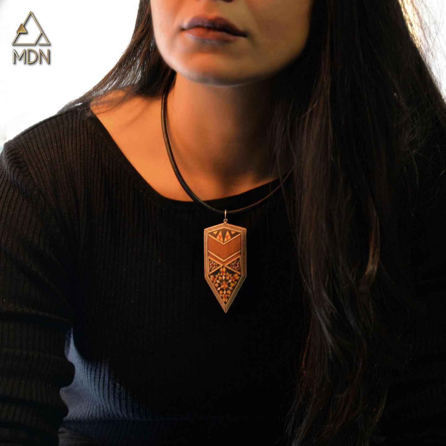 Pendant with wood mosaic inlay and black cord necklace