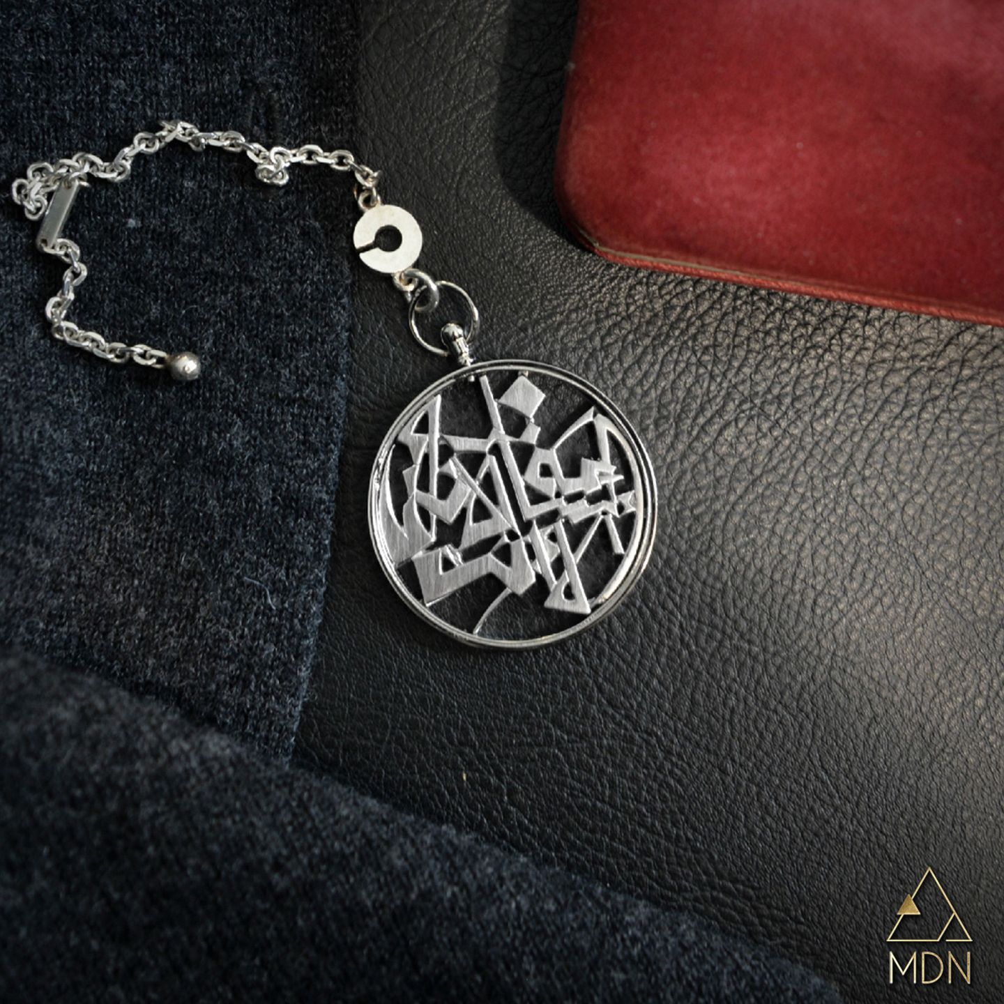 Pendant with Arabic calligraphy reading "الساعة الان انا الا انت".
