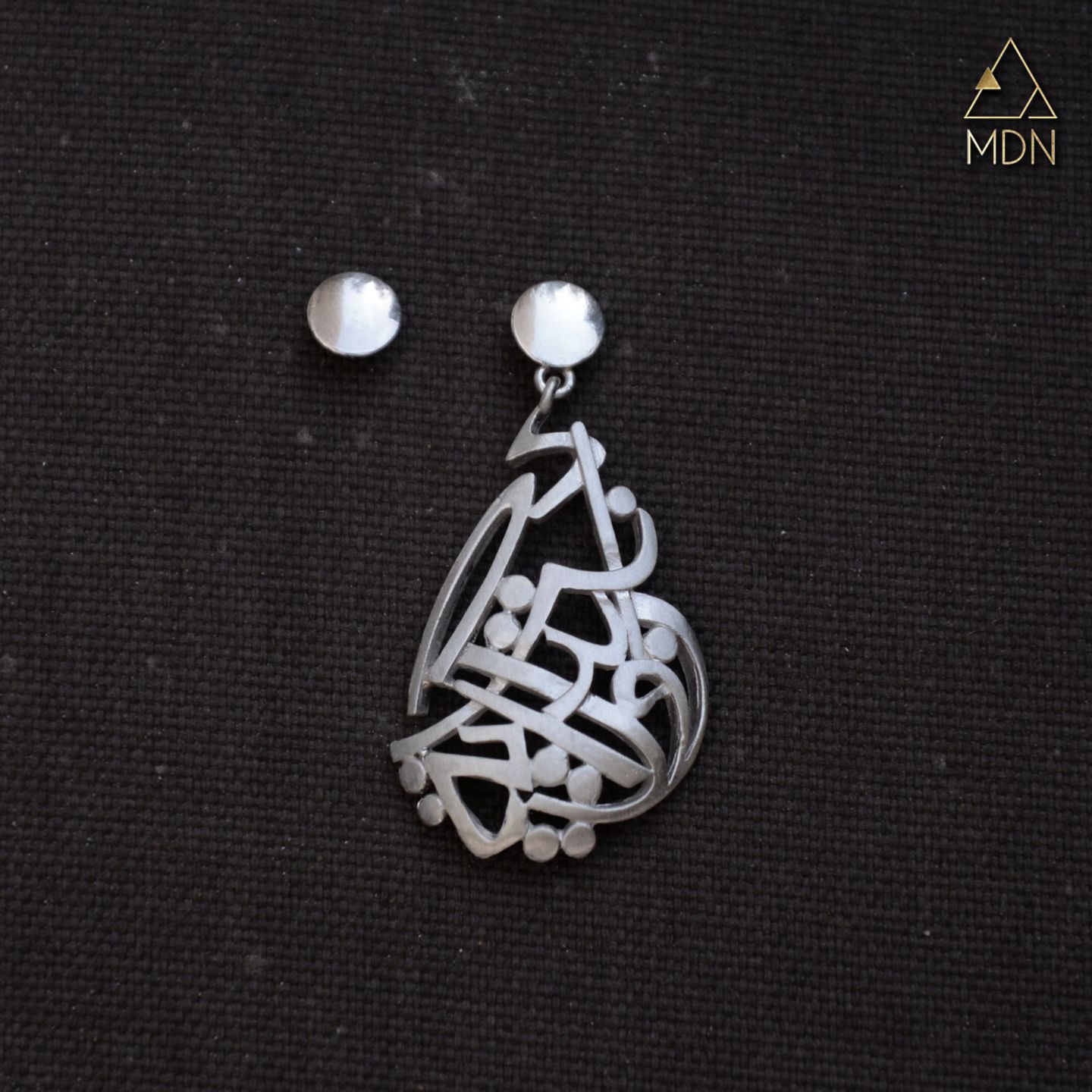 Earrings with Arabic calligraphy "انت بداية روحي" and pearl-toned posts.
