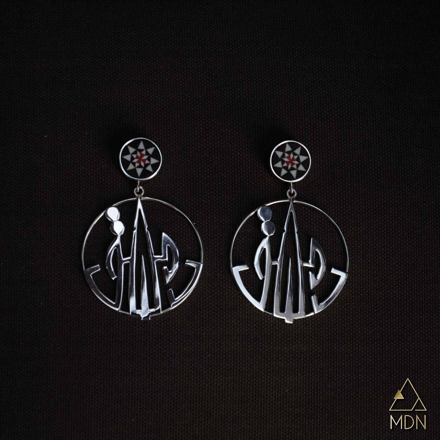 Pair of earrings with geometric Damascus pattern and Arabic calligraphy reading "دمشق".