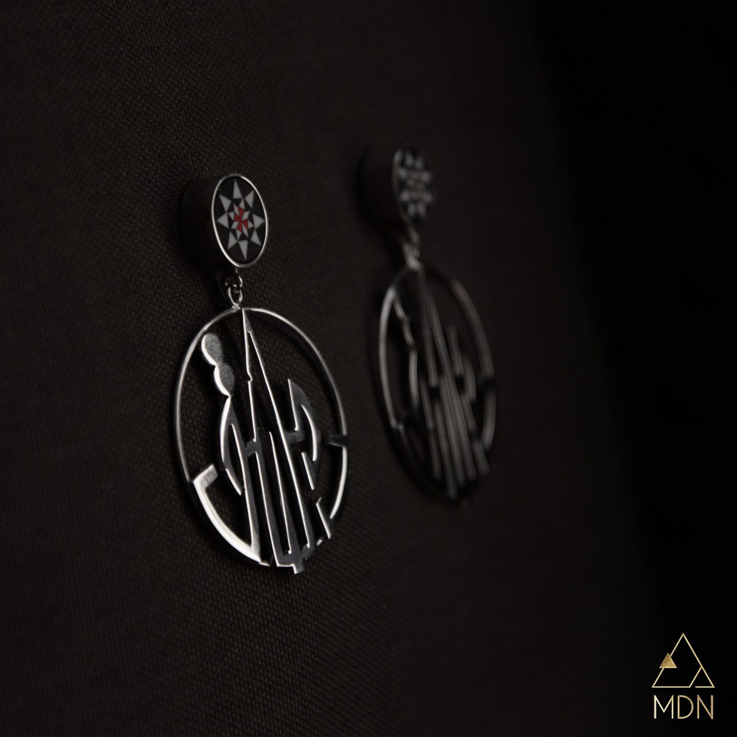 Pair of earrings with geometric Damascus pattern and Arabic calligraphy reading "دمشق".