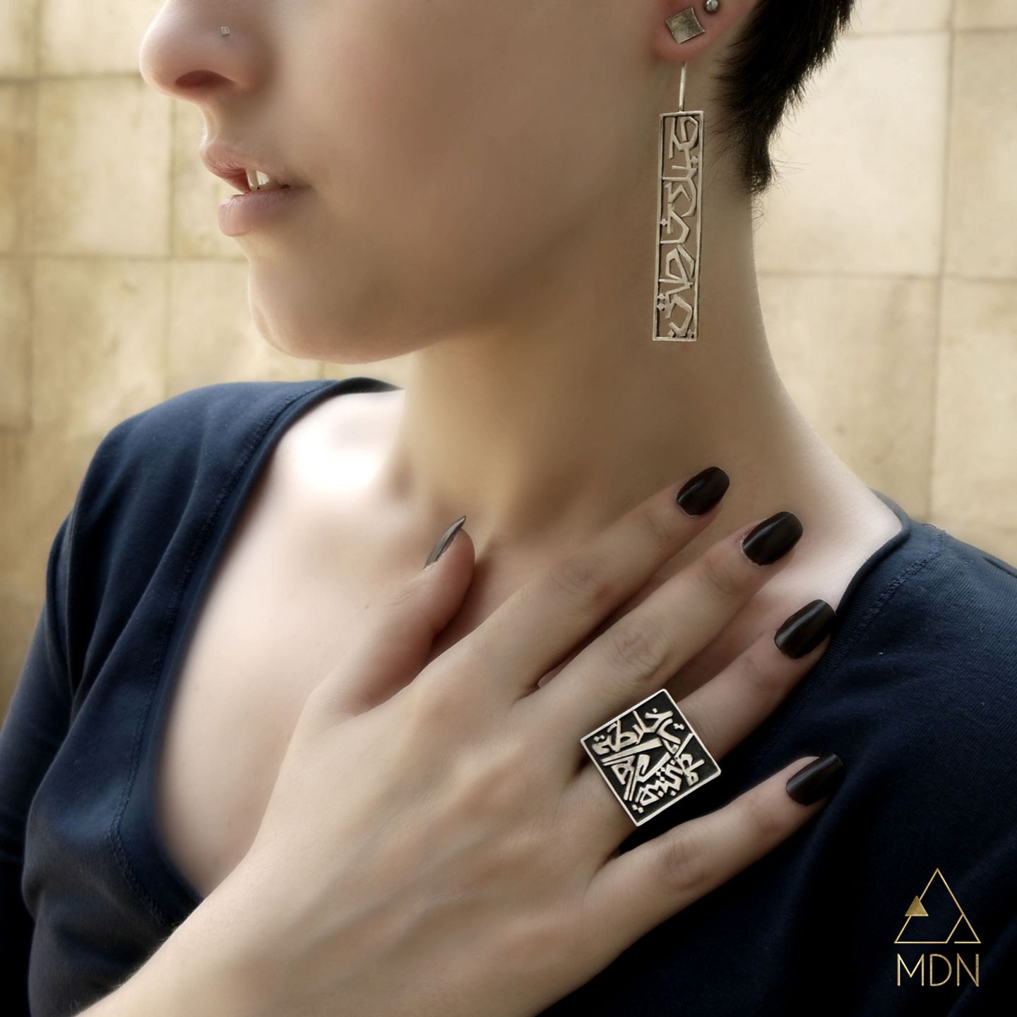 Ring and earrings with Arabic calligraphy "حبك خارطتي, ما عادت خارطة العالم تعنيني".