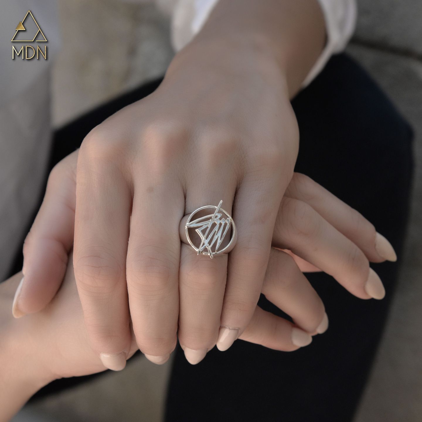 Ring rendering the name Sham in Arabic calligraphy.