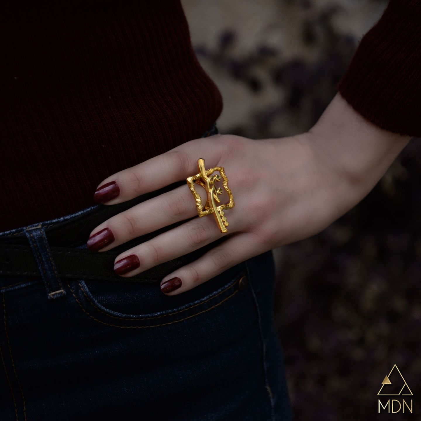Gold-toned ring with intricate geometric calligraphy reading "شغف".